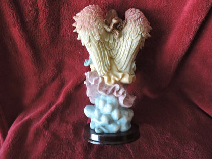 ANGEL HOLDING BABY PORCLAIN FIGURINE