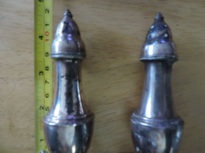 SILVER SALT AND PEPPER SHAKERS:  (5X1.5 INCHES) MADE IN THE USA