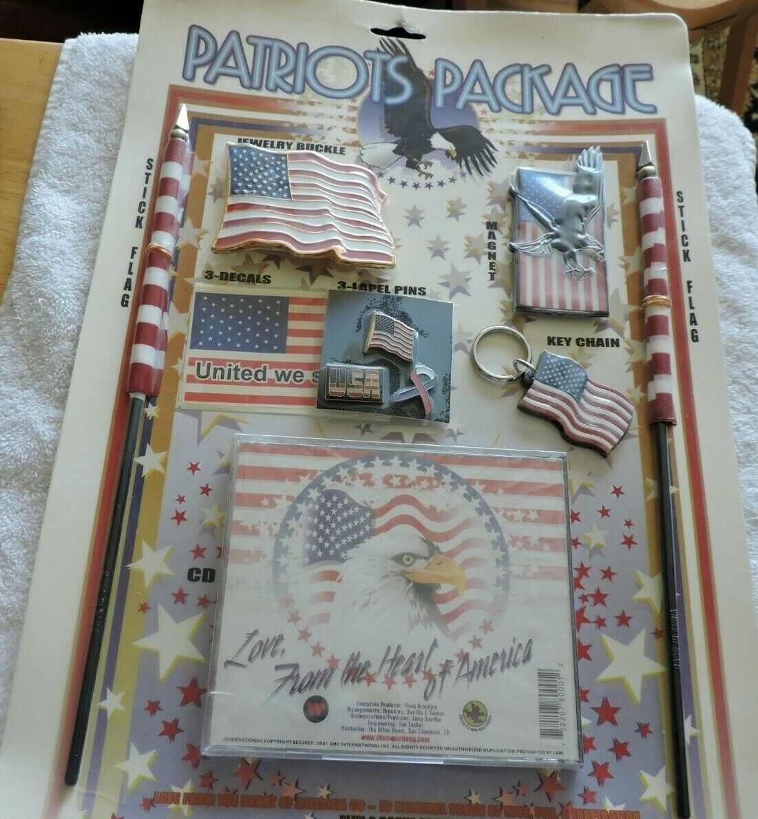 PATRIOT PACKAGE: 2 STICK FLAGS, BELT BUCKLE, MAGNET, 3 FLAG DECALS, 3 LAPEL PINS