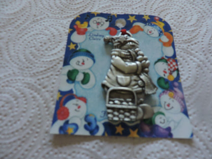 A LINDSAY CLAIRE DESIGN PEWTER SMOWWOMAN ORNAMENT