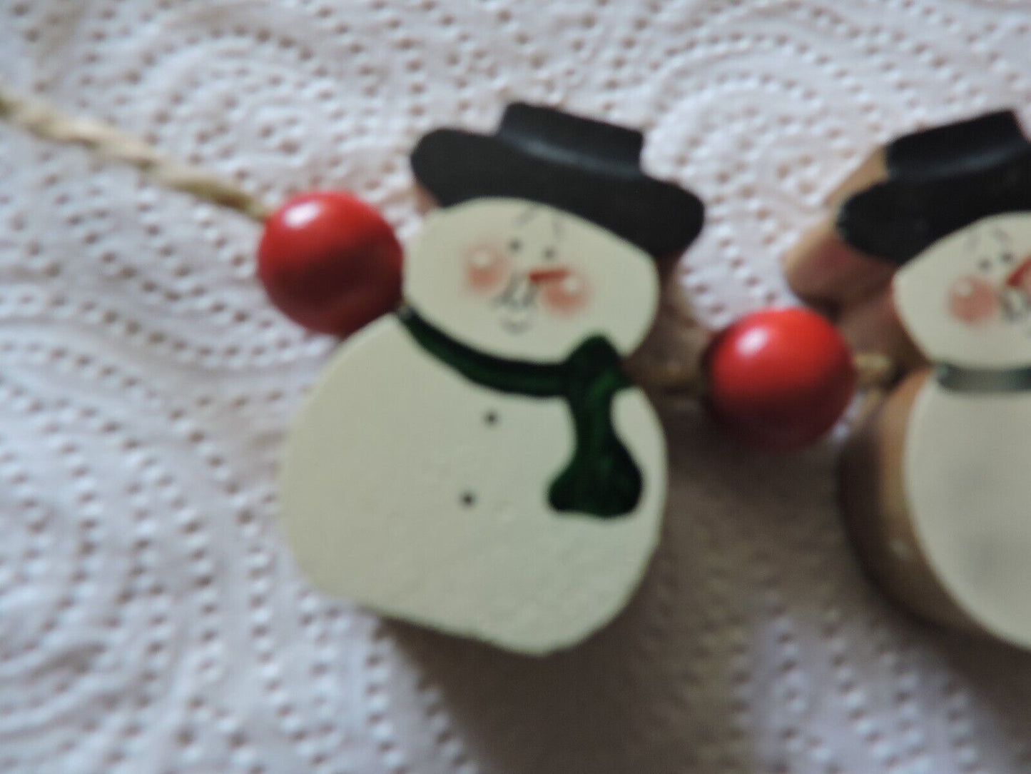 THREE WOODEN SNOWMEN ON ROPE DECORATION