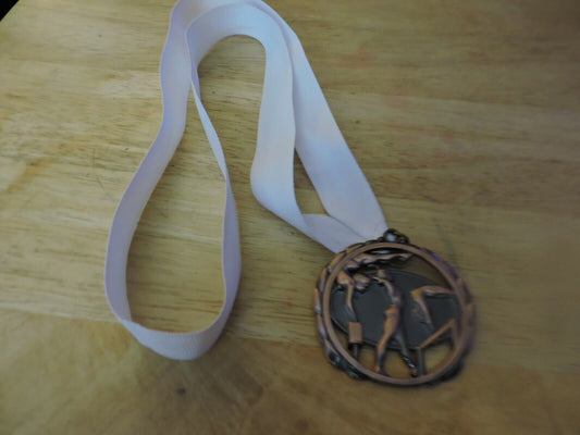 GYMNASTIC BRONZE COLORED 2.5 INCH MEDAL WITH WHITE RIBBON