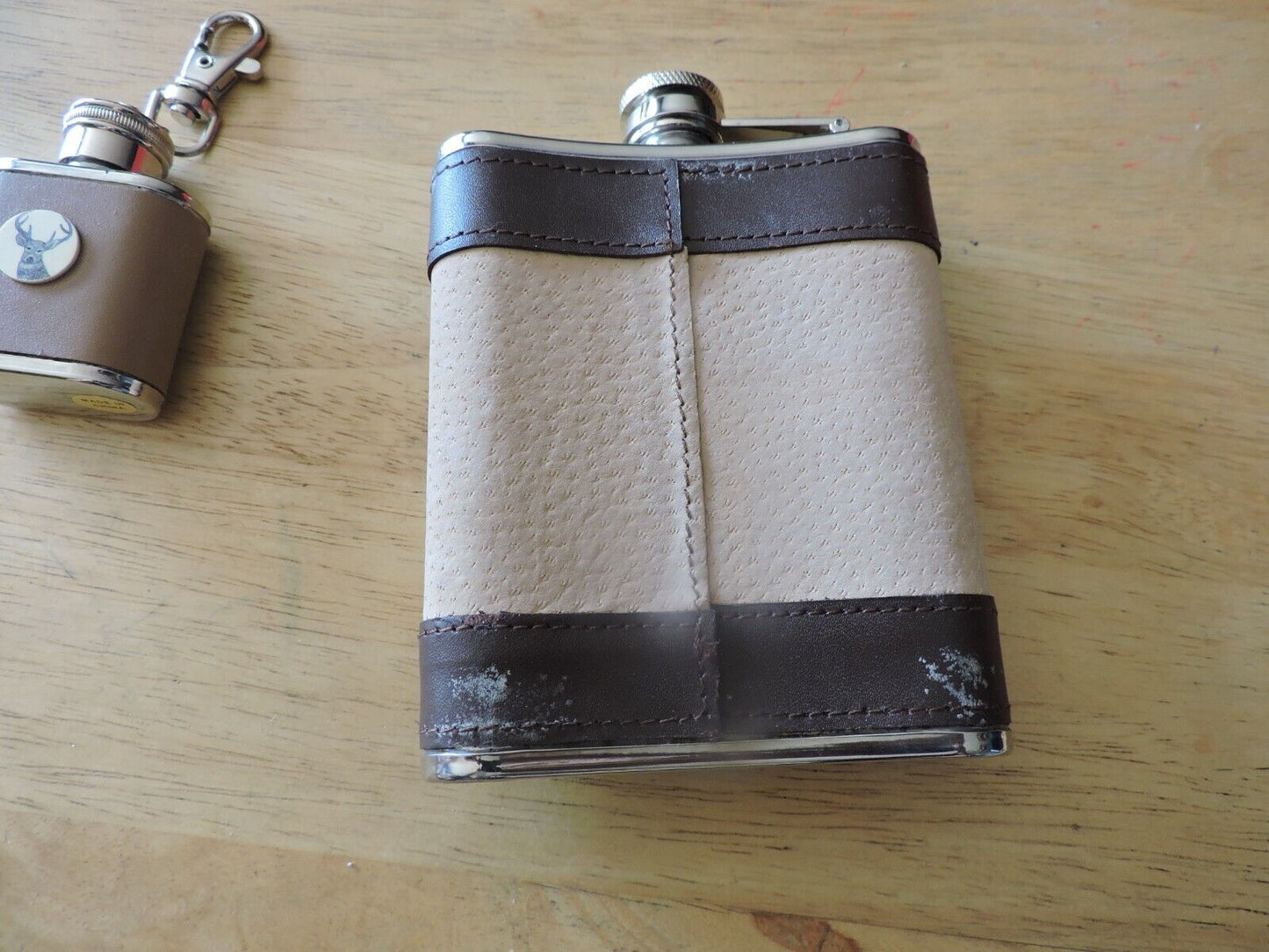 SET OF TWO STAINLESS STEEL FLASKS-- 4.5X4X.75 INCHES & 1.75X1.75X.75 INCHES