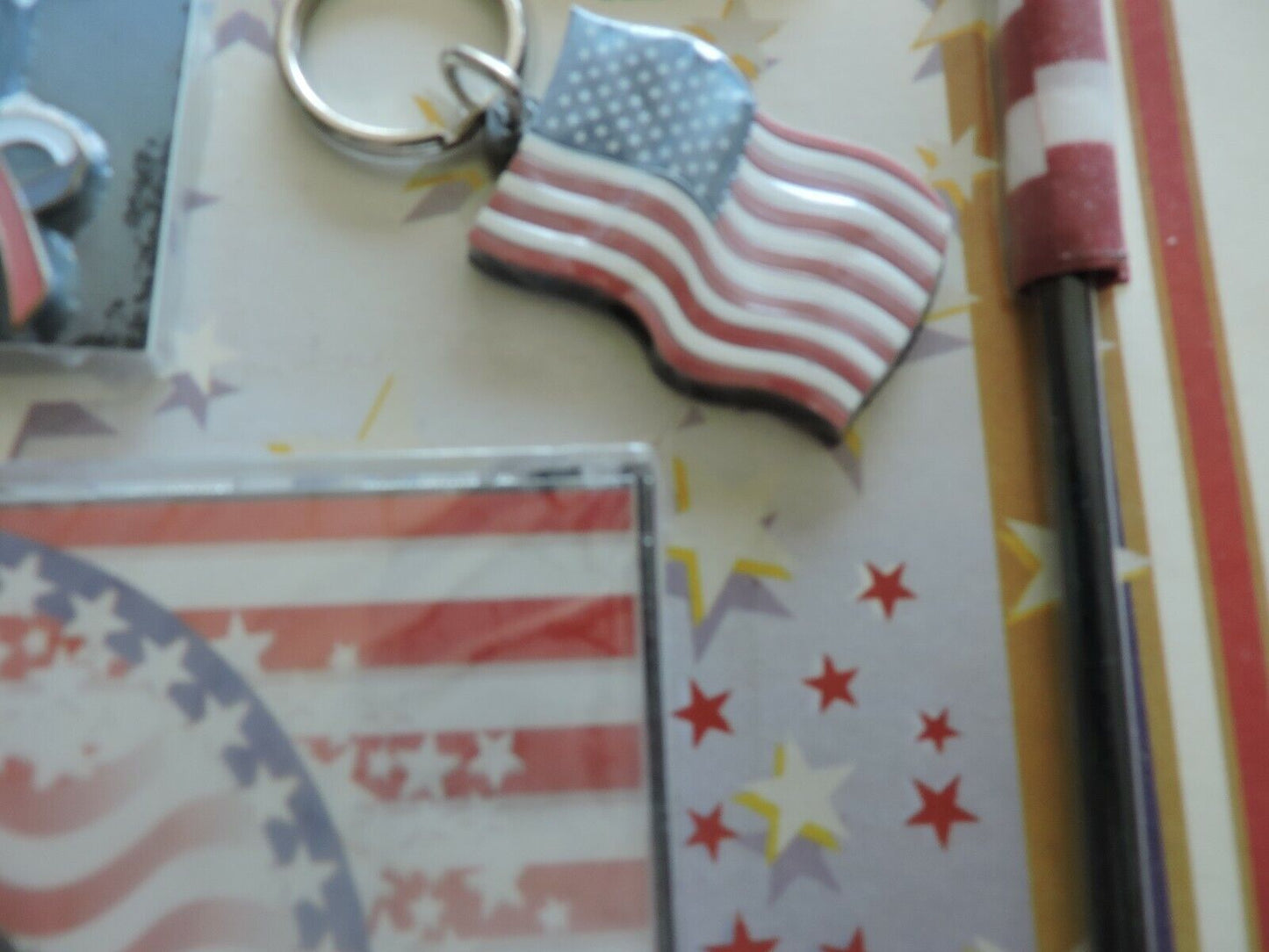 PATRIOT PACKAGE: 2 STICK FLAGS, BELT BUCKLE, MAGNET, 3 FLAG DECALS, 3 LAPEL PINS
