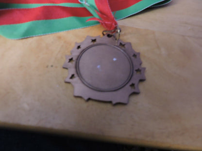 GYMNASTIC GOLD COLORED 2.5 INCH ROUND MEDAL WITH RED AND GREEN RIBBON