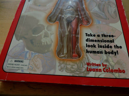 UNCOVER THE HUMAN BODY  THREE DIMENSIONAL LOOK INSIDE THE BODY. 2002