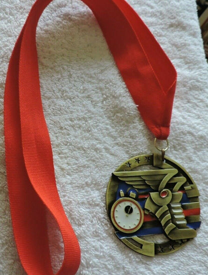 TRACK AND FIELD/RUNNING MEDAL 2.75 INCH ROUND WITH RED RIBBON