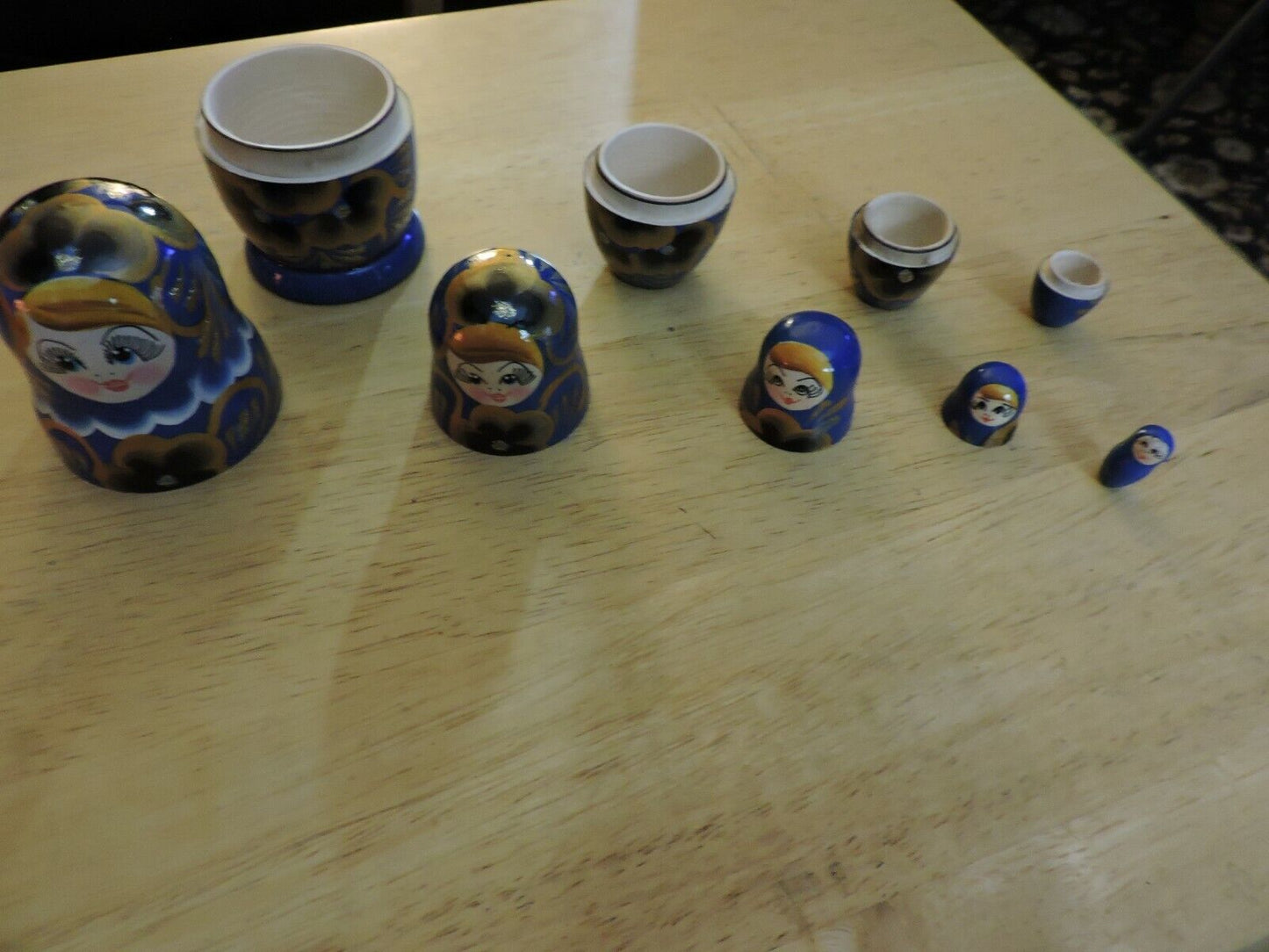 SET OF FIVE  WOODEN NESTING DOLLS (LARGEST 4 INCHES TALL)