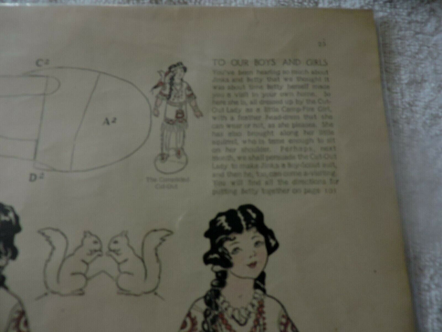 FEBRUARY 1914: " OUR BETTY AS A CAMP FIRE GIRL" CUT OUT: DESIGNED BY MARGARET PE