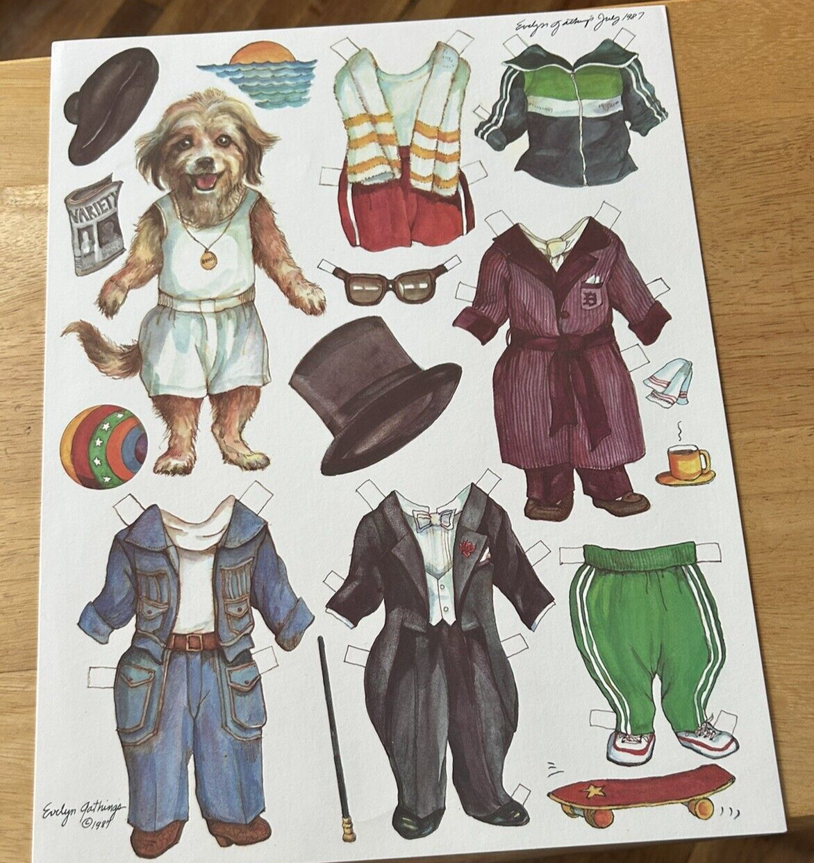 EVELYN GATHINGS: DOG WITH OUTFITS PAPER DOLL JULY 1987
